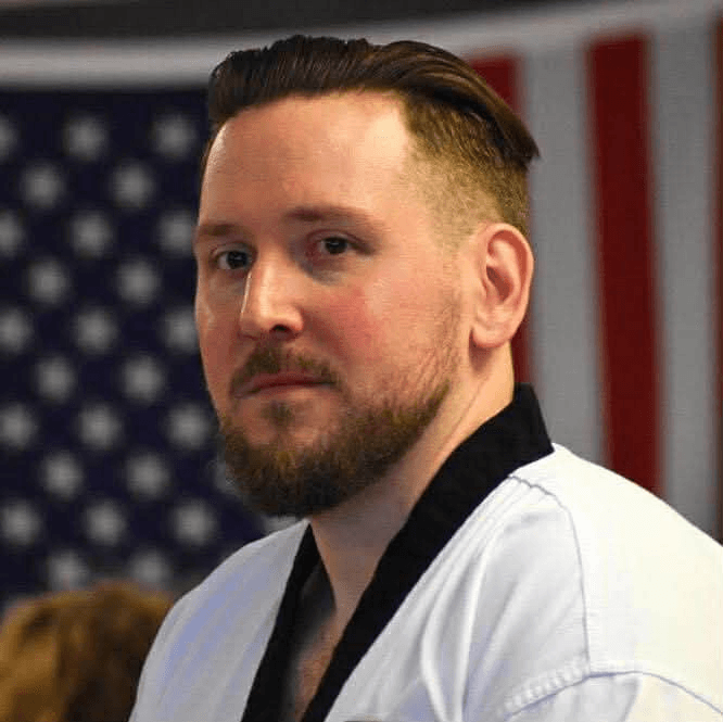 Wyatt Sebers, in front of the American flag